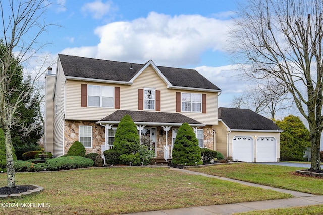 view of front of home featuring aphalt driveway, a garage, stone siding, a front lawn, and a chimney