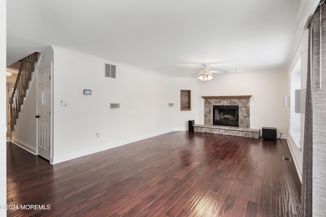 unfurnished living room with visible vents, dark wood finished floors, and ornamental molding