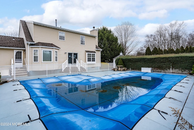 view of swimming pool with a fenced in pool