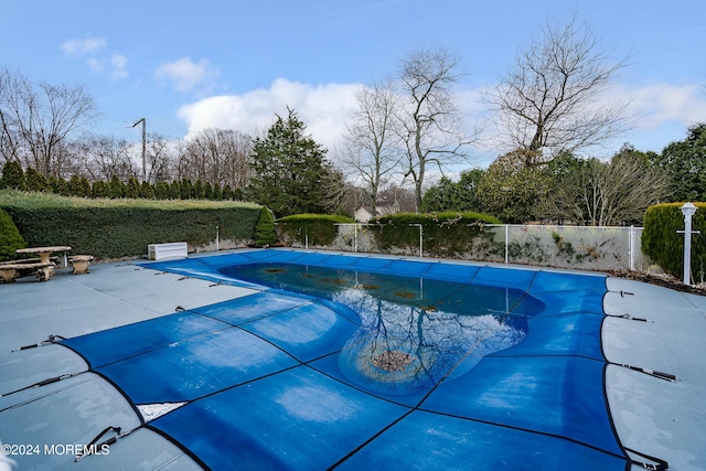 view of pool featuring a patio, fence, and a fenced in pool