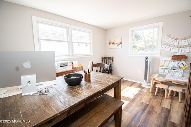 dining room with wood finished floors and baseboards