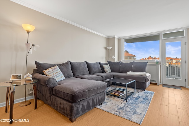 living room featuring light wood-style floors and crown molding