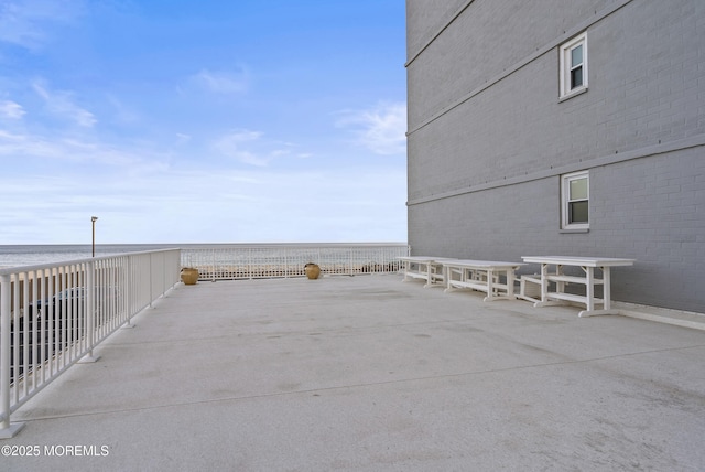 view of patio featuring a water view