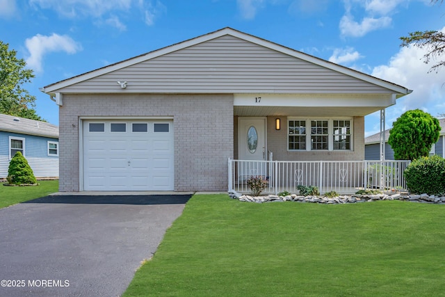 view of front facade with a garage, covered porch, brick siding, and a front lawn