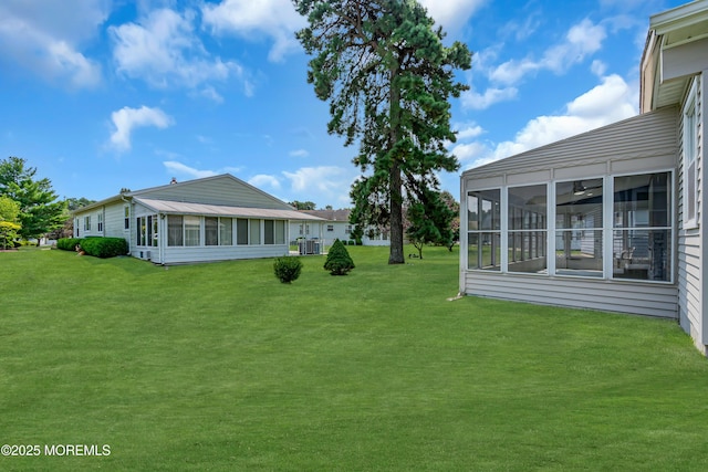 view of yard with a sunroom