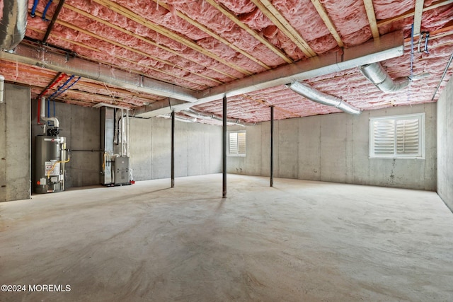 basement with heating unit and water heater