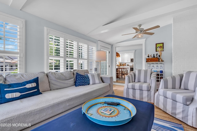 living room featuring lofted ceiling and ceiling fan