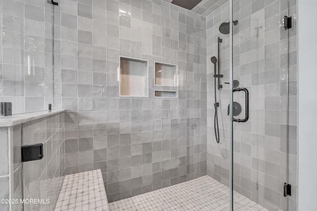 bathroom featuring a shower stall