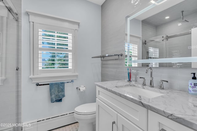 bathroom with tasteful backsplash, a baseboard radiator, toilet, a shower stall, and vanity