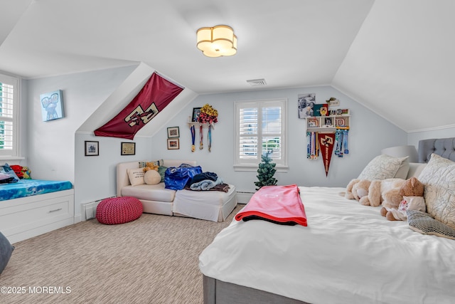 bedroom with lofted ceiling, a baseboard radiator, multiple windows, and visible vents