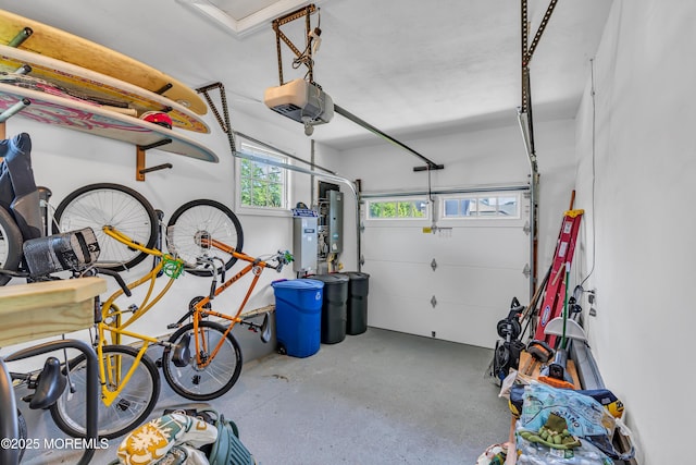 garage featuring electric panel and a garage door opener