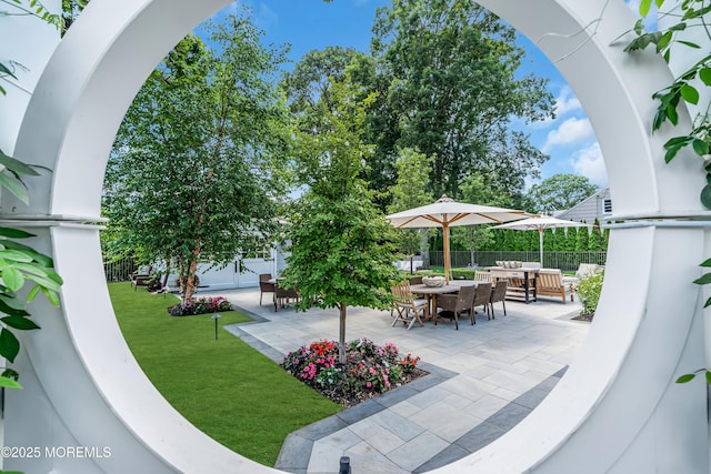 exterior space with a patio, a fenced backyard, and an outdoor living space