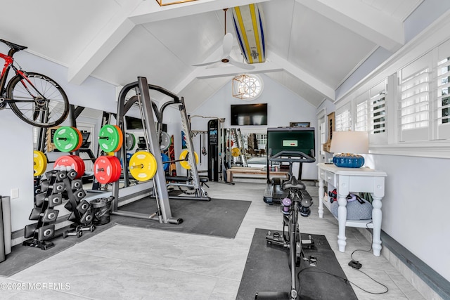 exercise area featuring lofted ceiling and baseboards