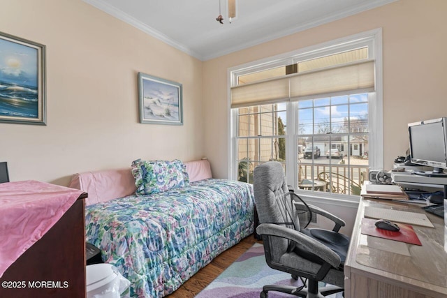 bedroom featuring ornamental molding, multiple windows, and dark wood finished floors