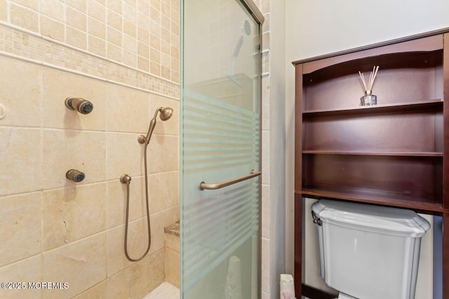 full bathroom featuring a stall shower and toilet