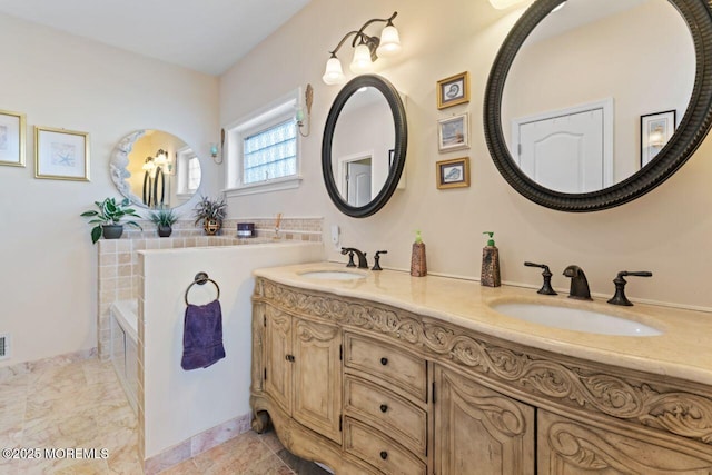 bathroom featuring double vanity, visible vents, and a sink