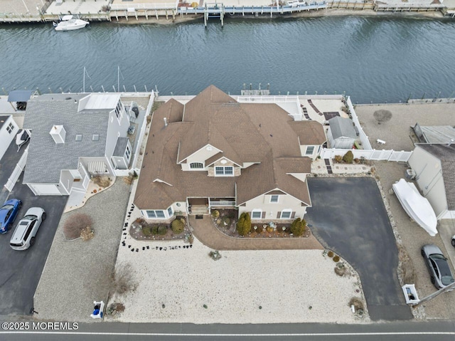 bird's eye view featuring a water view and a residential view