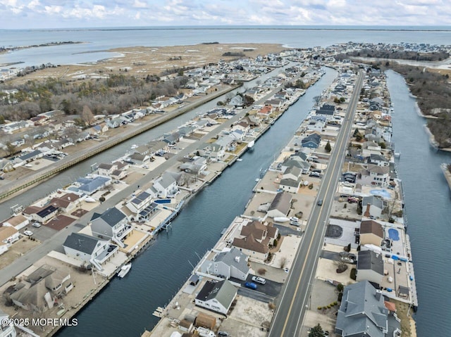 birds eye view of property featuring a residential view and a water view