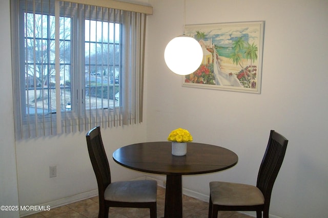 tiled dining space with baseboards