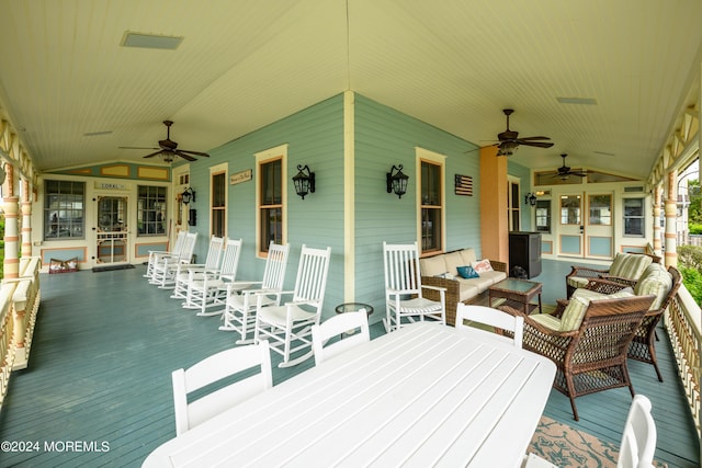 deck with covered porch, outdoor lounge area, and a ceiling fan