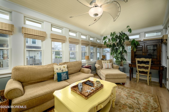 sunroom featuring wooden ceiling, vaulted ceiling, and a ceiling fan