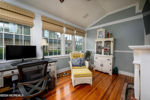 office with lofted ceiling, wooden ceiling, wood finished floors, baseboards, and crown molding