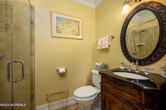 full bath with tiled shower, vanity, toilet, and crown molding