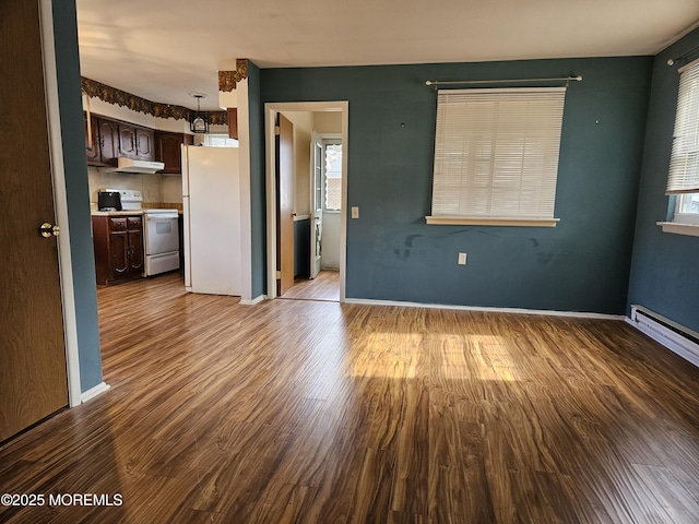 interior space featuring light wood-type flooring and baseboards