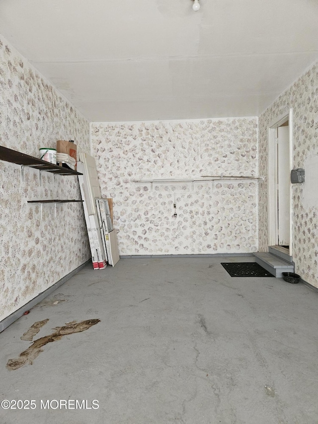 interior space with wallpapered walls