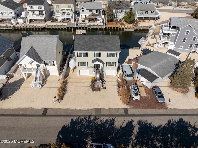 birds eye view of property featuring a residential view and a water view