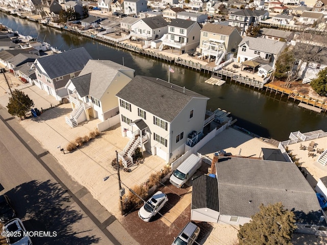 aerial view with a water view and a residential view