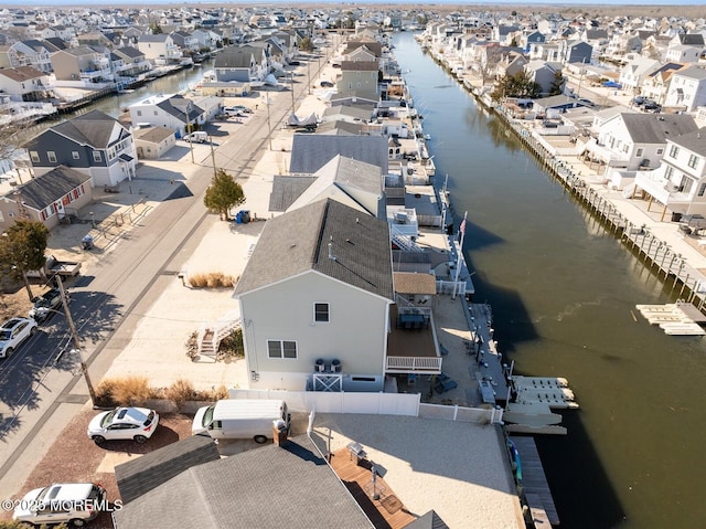 birds eye view of property with a residential view and a water view