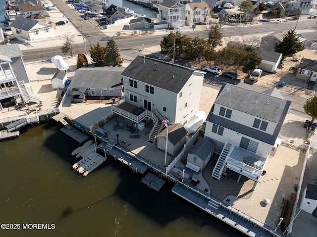 aerial view featuring a water view and a residential view