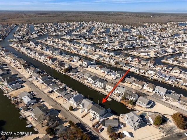 aerial view with a water view and a residential view