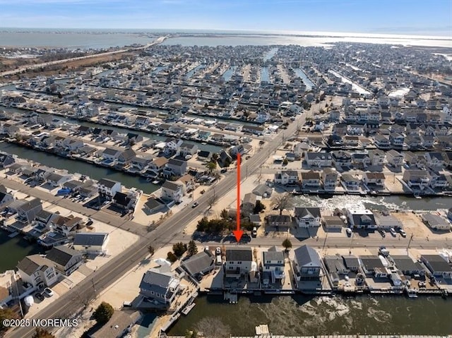 birds eye view of property featuring a residential view and a water view