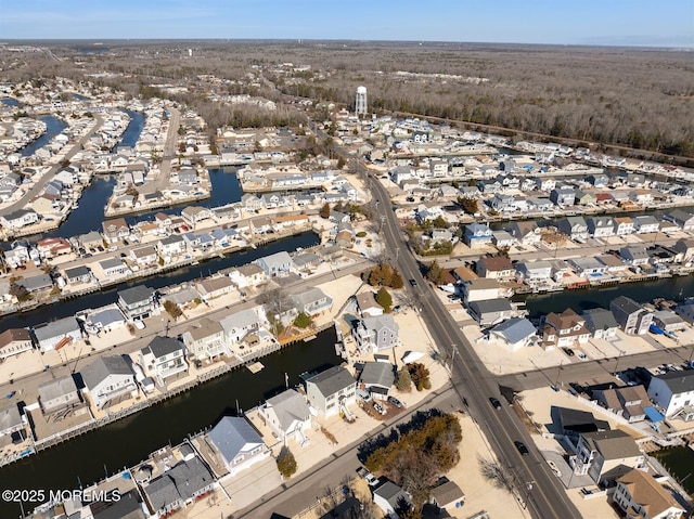 birds eye view of property with a residential view and a water view