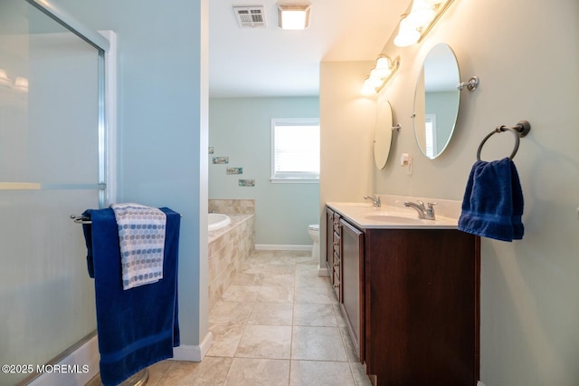 full bathroom with toilet, a sink, visible vents, a bath, and tile patterned floors