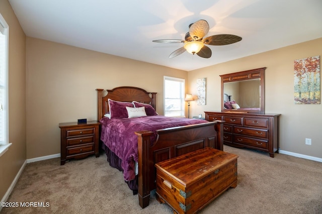 bedroom featuring light carpet, ceiling fan, and baseboards