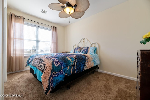 bedroom featuring carpet floors, baseboards, visible vents, and a ceiling fan