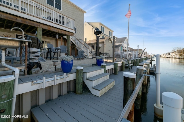 view of dock with a water view and stairs