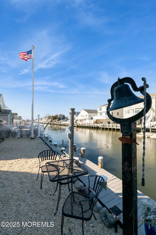 dock area with a water view