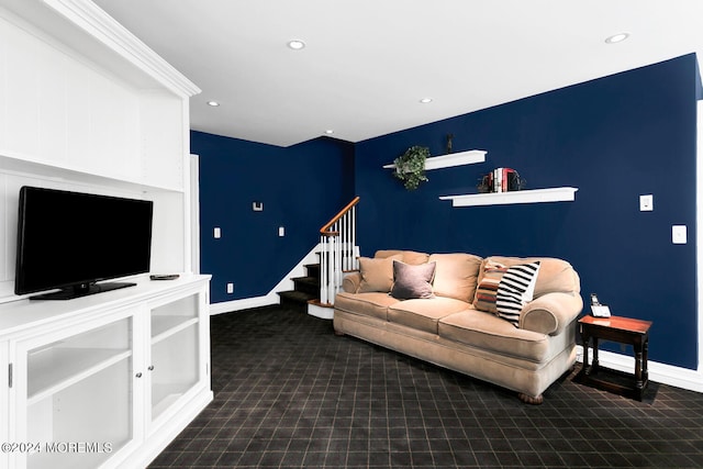 living area with baseboards, stairway, and recessed lighting