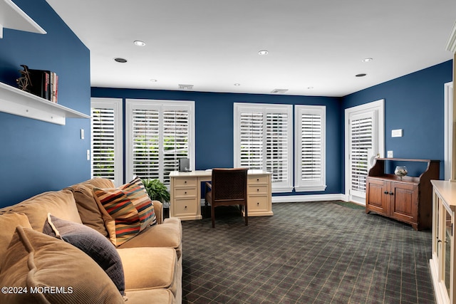 office space featuring recessed lighting, dark carpet, and baseboards