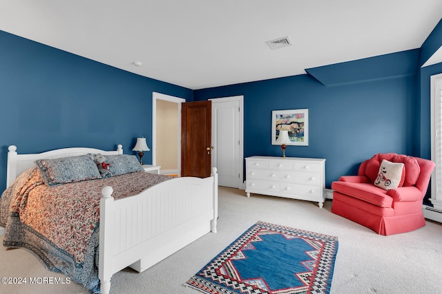 bedroom with visible vents and light colored carpet