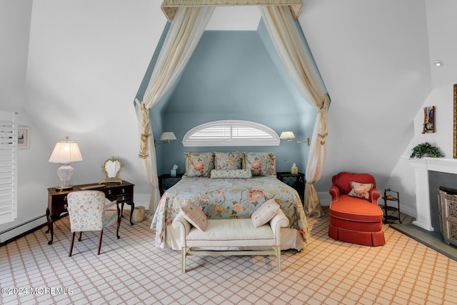 bedroom with high vaulted ceiling, a fireplace, and a baseboard radiator