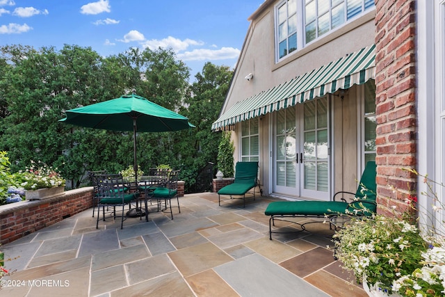 view of patio / terrace featuring french doors and outdoor dining area