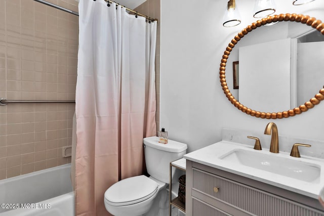 bathroom featuring toilet, shower / bath combo, and vanity