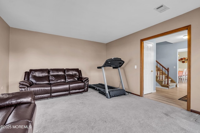 interior space featuring carpet, visible vents, and baseboards