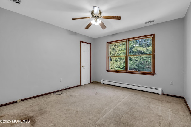 unfurnished room with visible vents, a baseboard heating unit, light carpet, ceiling fan, and baseboards