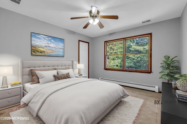 bedroom featuring a ceiling fan, baseboard heating, visible vents, and light colored carpet